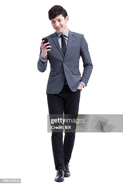 young businessman with smart phone - asian businessman phone photos et images de collection