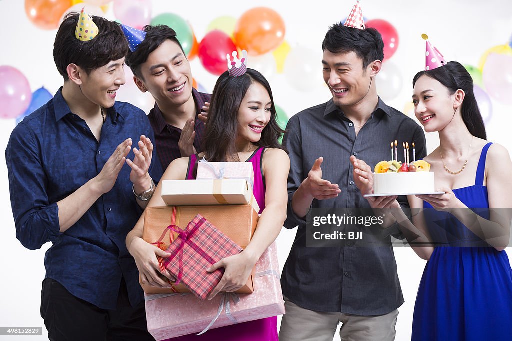 Young adults having a birthday party