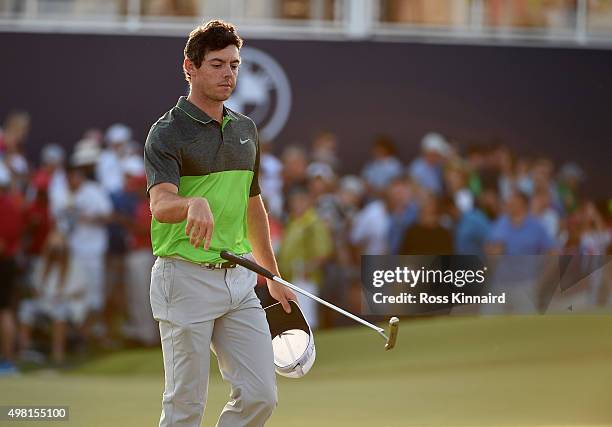 Rory McIlroy of Northern Ireland reacts to his par on his last hole, the par five 18th hole during the third round of the DP World Tour Championship...