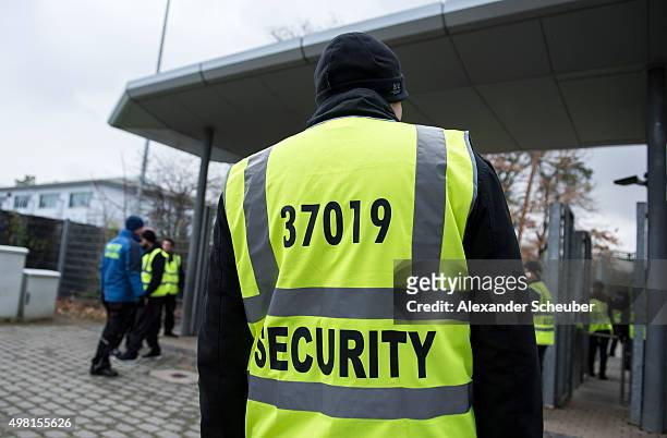 Spectators are checked by security guards before they get in to the stadium before the Bundesliga match between Eintracht Frankfurt and Bayer 04...