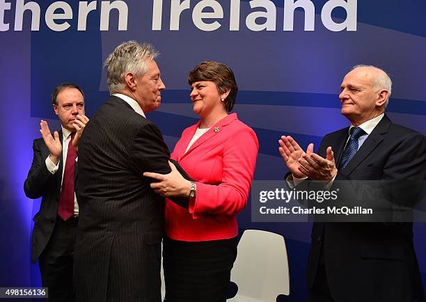 Peter Robinson is embraced by Arlene Foster after Robinson's final leader's speech during the Democratic Unionist Party annual conference at La Mon...