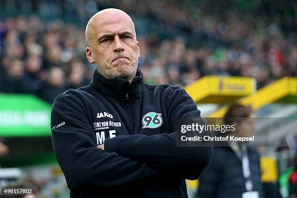 Head coach Michael Frontzeck of Hannover looks thoughtful during the Bundesliga match between Borussia Moenchengladbach and Hannover 96 at...