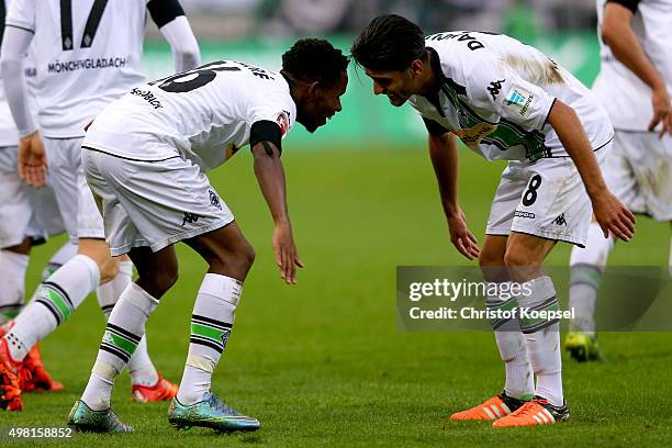 Ibrahima Traore of Moenchengladbach celebrates the first goal with Mahmoud Dahoud during the Bundesliga match between Borussia Moenchengladbach and...