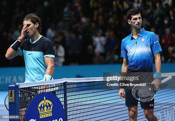 Rafael Nadal of Spain shows his emotions after his straight sets defeat by Novak Djokovic of Serbia during the men's singles semi final match on day...