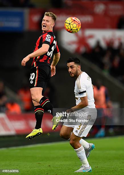Bournemouth player Matt Ritchie rises above Neil Taylor during the Barclays Premier League match between Swansea City and A.F.C. Bournemouth at...