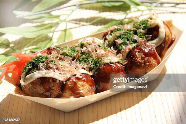 takoyaki (ball-shaped snack filled with octopus) - takoyaki stock pictures, royalty-free photos & images