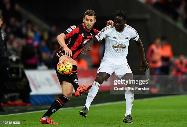 Bournemouth player Simon Francis challenges Eder of Swansea during the Barclays Premier League match between Swansea City and A.F.C. Bournemouth at...