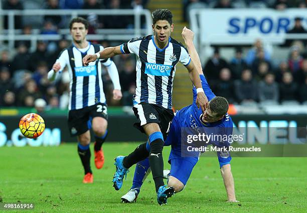 Ayoze Perez of Newcastle is tackled by Robert Huth of Leicester during the Barclays Premier League match between Newcastle United FC and Leicester...