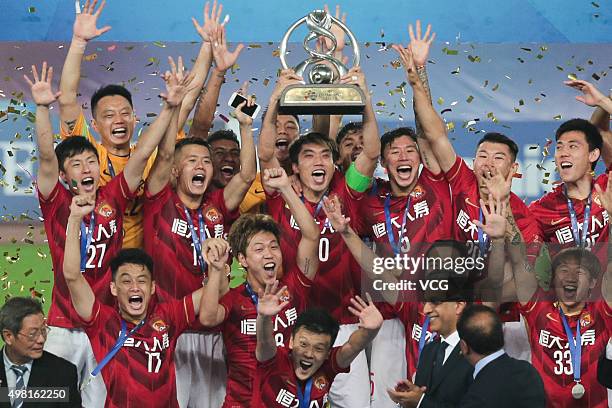 Guangzhou Evergrande players celebrate with the trophy after winning the second leg of the AFC Champions League final match between Guangzhou...