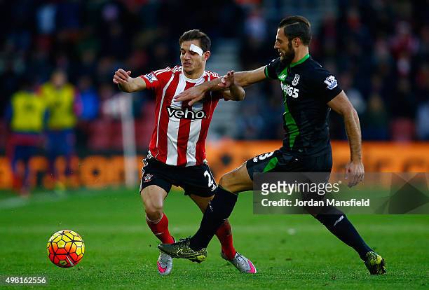 Cedric Soares of Southampton and Erik Pieters of Stoke City compete for the ball during the Barclays Premier League match between Southampton and...