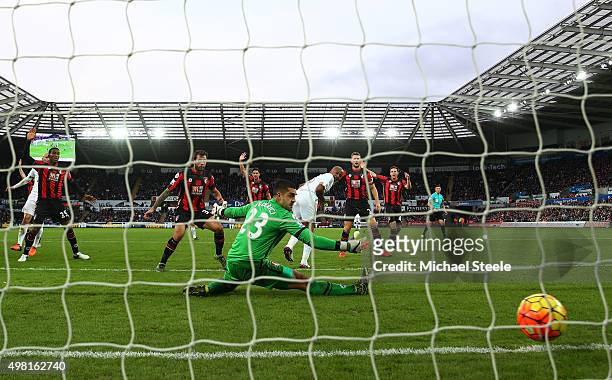 Andre Ayew of Swansea City scores his team's first goal past Adam Federici of Bournemouth during the Barclays Premier League match between Swansea...