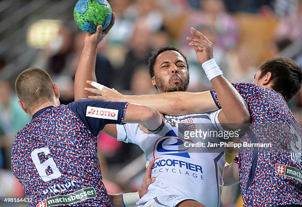 Drago Vukovic of Fuechse Berlin, Timothey N`Guessan of Chambery Savoie HB and Fabian Wiede of Fuechse Berlin during the game between Fuechse Berlin...