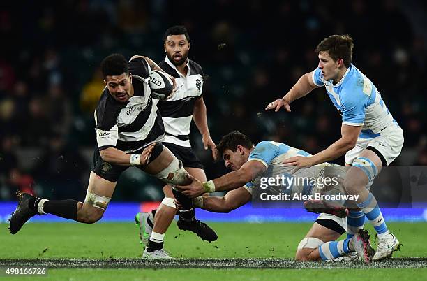 Ardie Savea of Barbarians is tackled by Pablo Matera of Argentina during the Killik Cup match between Barbarians and Argentina at Twickenham Stadium...