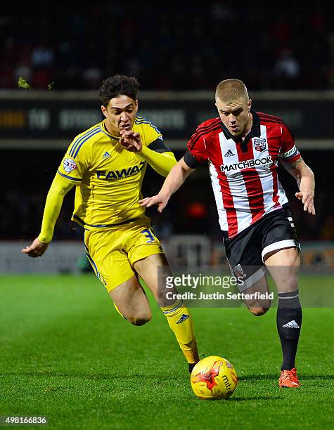 Tyler Walker of Nottingham Forest and Jake Bidwell of Brentford during the Sky Bet Championship match between Brentford and Nottingham Forest at...
