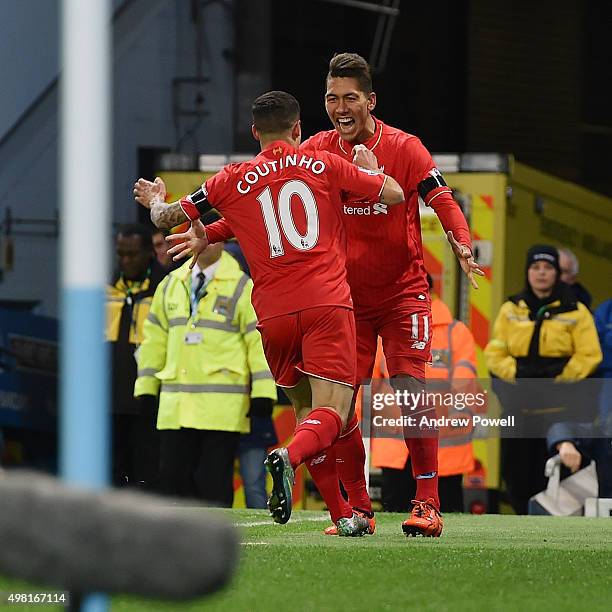 Roberto Firmino and Philippe Coutinho of Liverpool celebrates the opening goal during the Barclays Premier League match between Manchester City and...