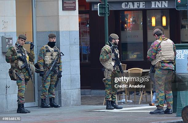 Soldiers and police patrol in streets, in Brussels where all stores had to close following the terror alert level being elevated to 4, in Brussels,...