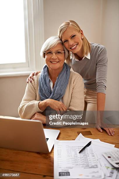 helping her grandmother make sense of any financial problem - grandma invoice bildbanksfoton och bilder