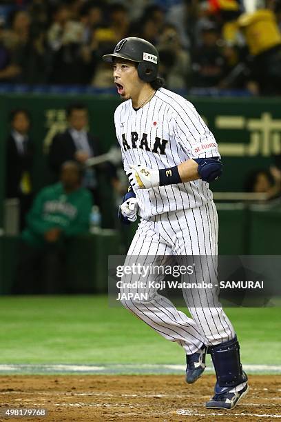 Nobuhiro Matsuda of Japan celebrates as he scores after hitting a two-run home-run in the bottom half of the second inning during the WBSC Premier 12...