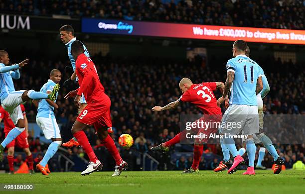 Martin Skrtel of Liverpool scores his team's fourth goal during the Barclays Premier League match between Manchester City and Liverpool at Etihad...