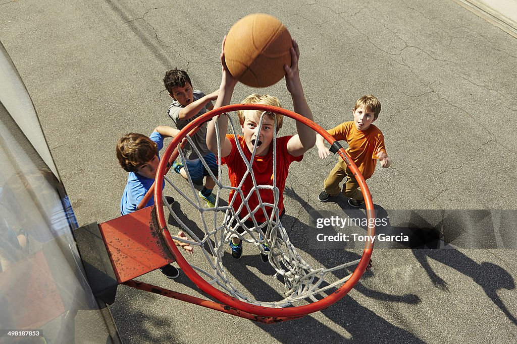 Boys playing basketball, high angle