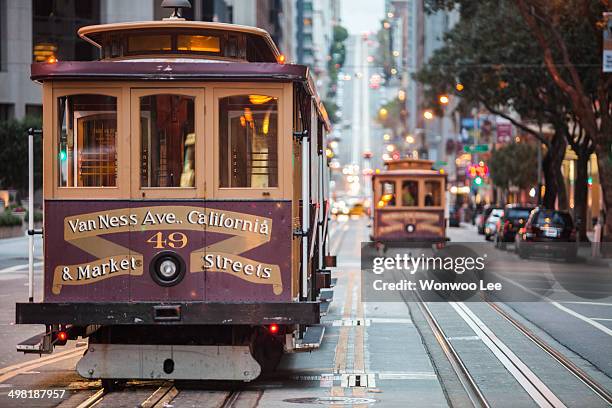 cable cars on city street, san francisco, california, usa - são francisco califórnia imagens e fotografias de stock