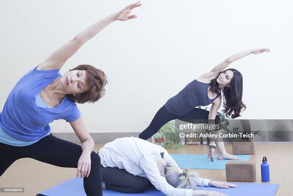 Women practising yoga