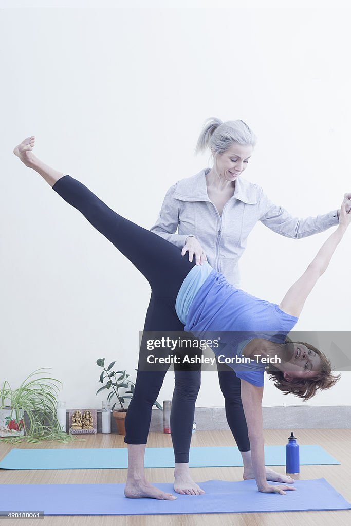 Women practising yoga