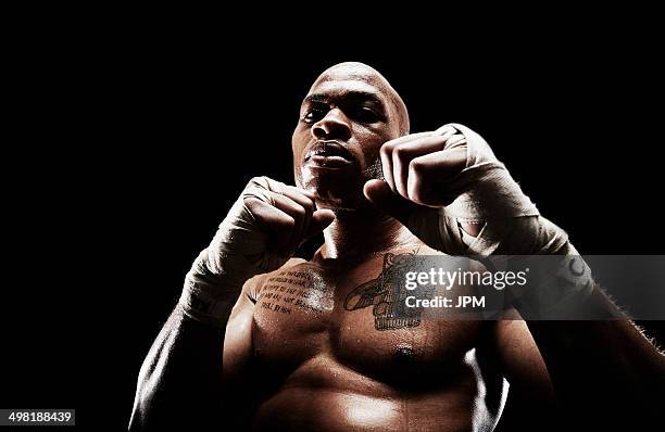 mid adult man boxing - fighter portraits stock pictures, royalty-free photos & images