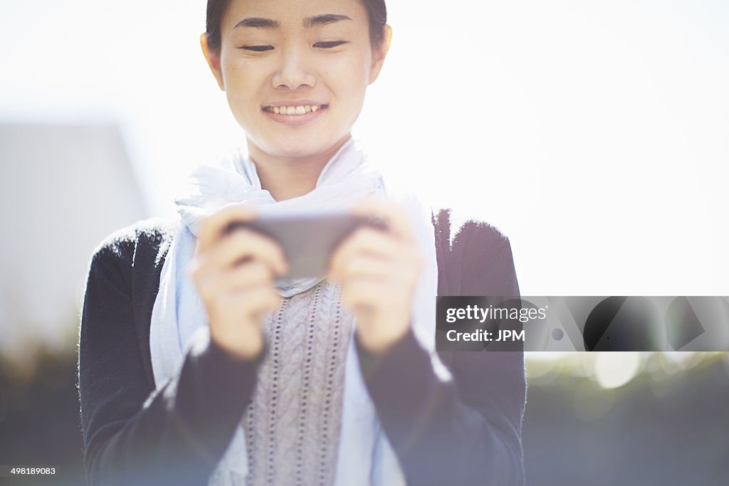 Young woman using smartphone