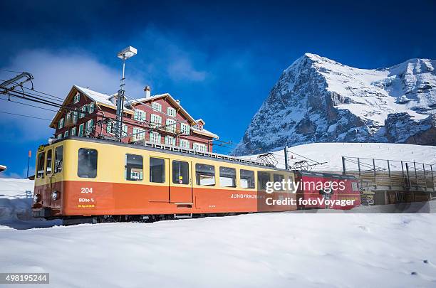 switzerland jungfraubahn mountain railway ski hotel chalets below eiger alps - eiger mönch jungfrau stock pictures, royalty-free photos & images