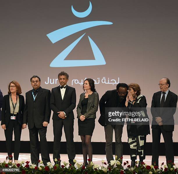 President of the jury of the 26th Carthage Film Festival, Morocco's Noureddine Sail , stands next to jury members Palestine's Leila Shahid, Nigeria's...