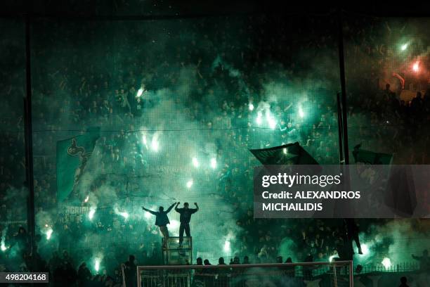 Panathinaikos' fans light flares after the cancellation of the Greek Super League match between Panathinaikos and Olympiakos at Apostolos Nikolaides...