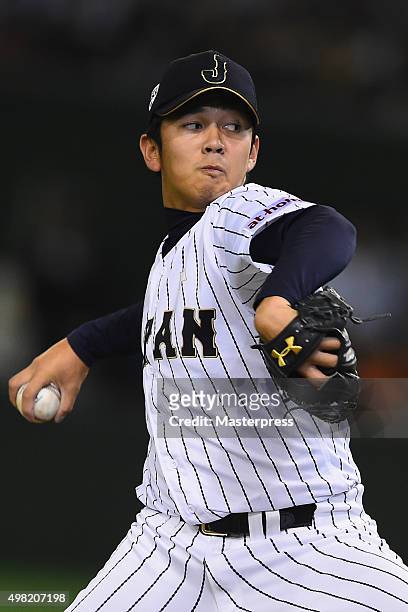Yasuaki Yamasaki of Japan pitches in the top half of the seventh inning during the WBSC Premier 12 third place play off match between Japan and...