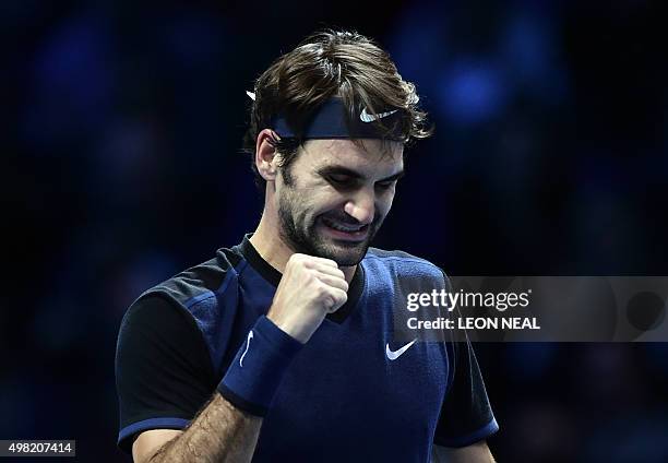 Switzerland's Roger Federer celebrates after beating Switzerland's Stan Wawrinka in a men's singles semi-final match on day seven of the ATP World...