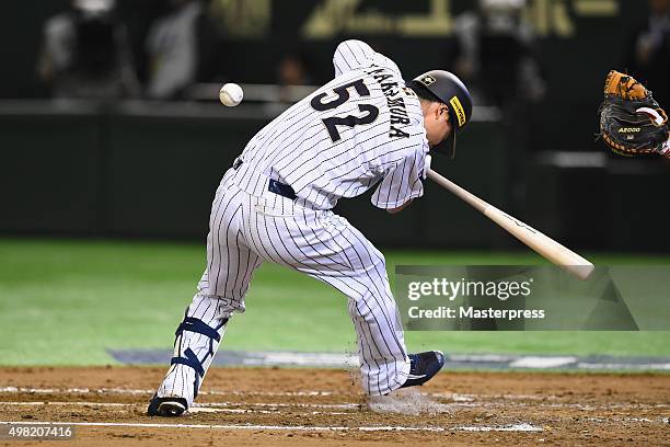 Yuhei Nakamura of Japan gets hit by a pitch in the bottom half of the seventh inning during the WBSC Premier 12 third place play off match between...