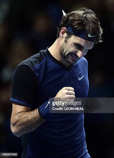 Switzerland's Roger Federer celebrates after beating Switzerland's Stan Wawrinka in a men's singles semi-final match on day seven of the ATP World...