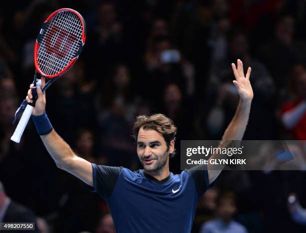 Switzerland's Roger Federer celebrates after beating Switzerland's Stan Wawrinka in a men's singles semi-final match on day seven of the ATP World...