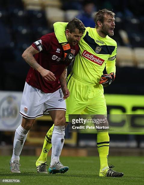 Roy Carroll of Notts County gets to grips with Marc Richards of Northampton Town during the Sky Bet League Two match between Notts County and...
