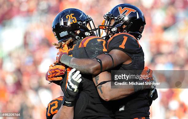 Wide receiver Isaiah Ford of the Virginia Tech Hokies reacts following his touchdown reception with tight end Bucky Hodges in the second half against...
