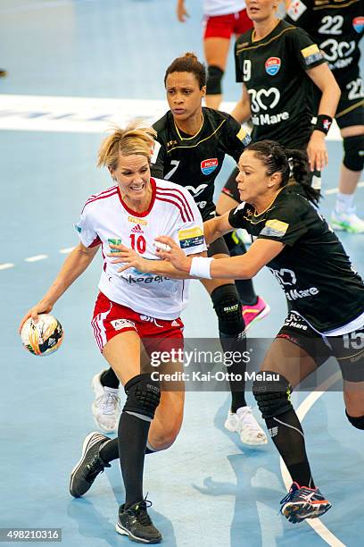 Gro Hammerseng-Edin wrestles with Valentina Neli Ardean Elisei in the game between Larvik HK and HCM Baia Mare on November 21, 2015 in Larvik, Norway.