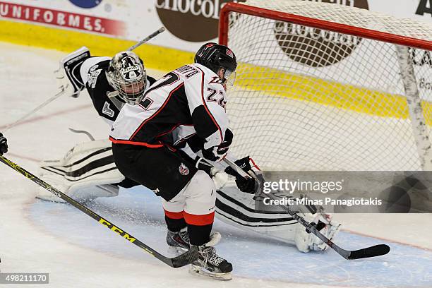 Goaltender Samuel Montembeault of the Blainville-Boisbriand Armada makes a skate save on Peter Abbandonato of the Huskies de Rouyn-Noranda during the...