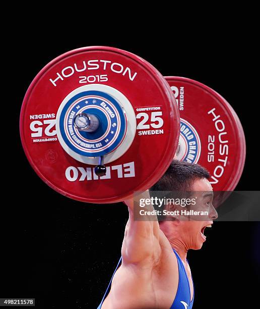 Jingbiao Wu of China breaks the world record with a snatch of 139kg in the men's 56kg weight class during the 2015 International Weightlifting...