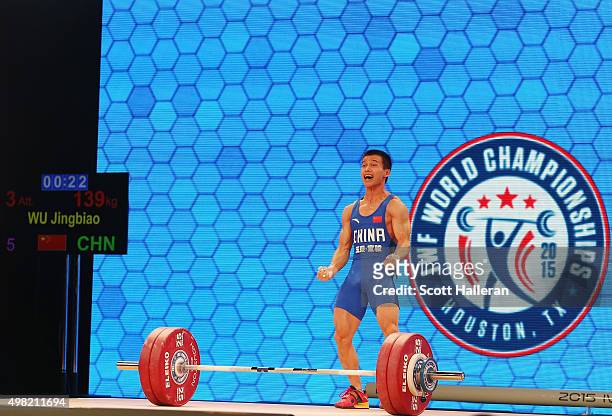 Jingbiao Wu of China celebrates after breaking the world record with a snatch of 139kg in the men's 56kg weight class during the 2015 International...