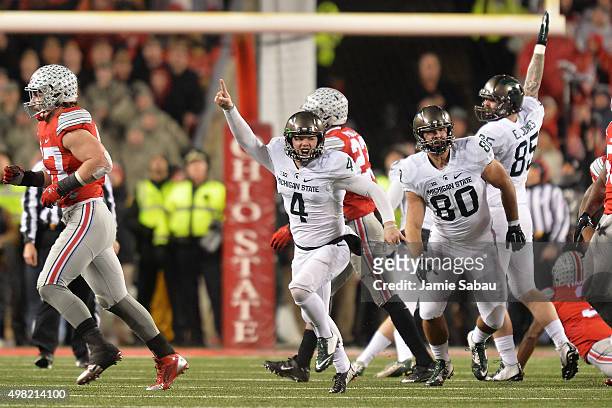 Michael Geiger of the Michigan State Spartans celebrates after kicking a 41-yard field goal as time expired against the Ohio State Buckeyes at Ohio...