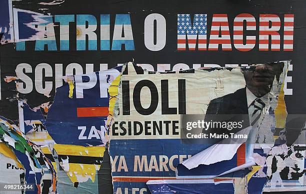 Presidential political posters are ripped and mingled along a wall on November 21, 2015 in Buenos Aires, Argentina. Argentina is facing its first...