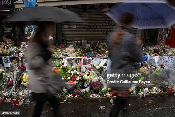 People pass by the memorial in "La Belle Equipe" restaurant in the 11th district of Paris, following a series of coordinated terrorists attacks on...