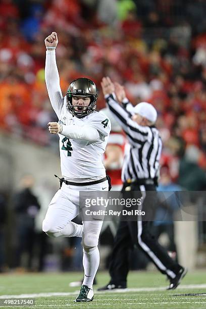 Michael Geiger of the Michigan State Spartans celebrates his game winning field goal against the Ohio State Buckeyes at Ohio Stadium on November 21,...