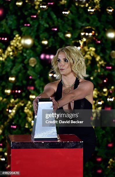 Singer Britney Spears pulls a switch during a Christmas tree-lighting ceremony at The LINQ Promenade on November 21, 2015 in Las Vegas, Nevada.