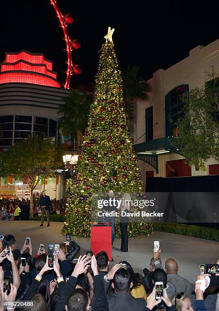 Radio personality Chet Buchanan and singer Britney Spears attend a Christmas tree-lighting ceremony at The LINQ Promenade on November 21, 2015 in Las...
