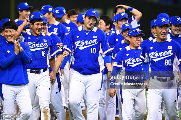 South Korea team celebrate after winning the WBSC Premier 12 final match between South Korea and the United States at the Tokyo Dome on November 21,...